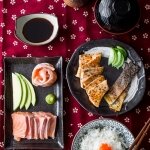 Sashimi donburi – Japanese sliced salmon on rice with condiments